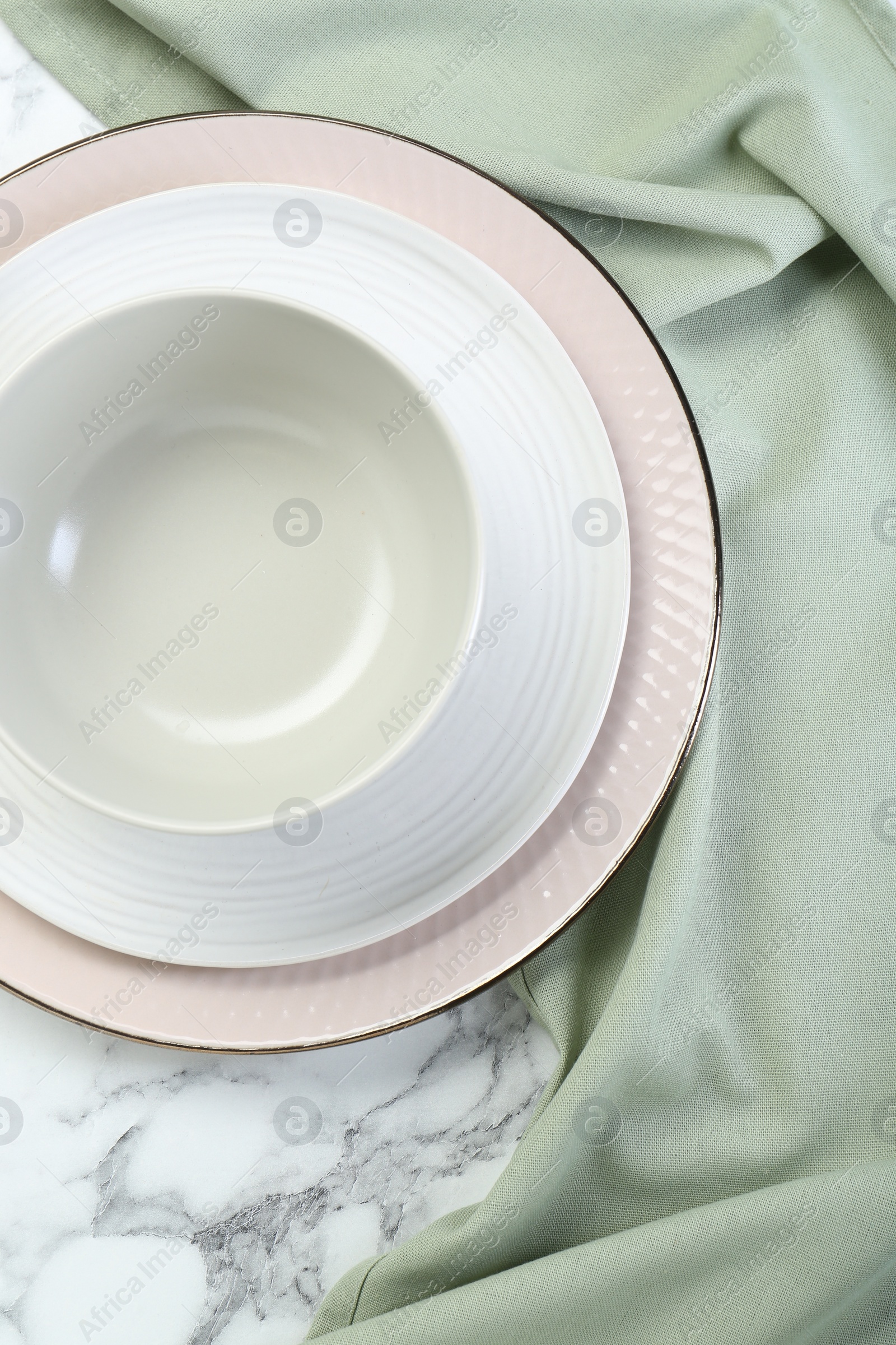 Photo of Clean plates and bowl on table, top view