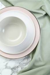 Photo of Clean plates and bowl on table, top view