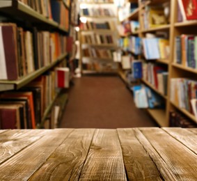 Image of Empty wooden table in library. Space for design 