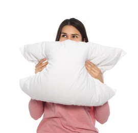 Young woman covering face with pillow on white background