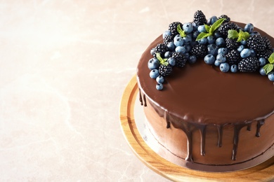 Photo of Fresh delicious homemade chocolate cake with berries on table. Space for text