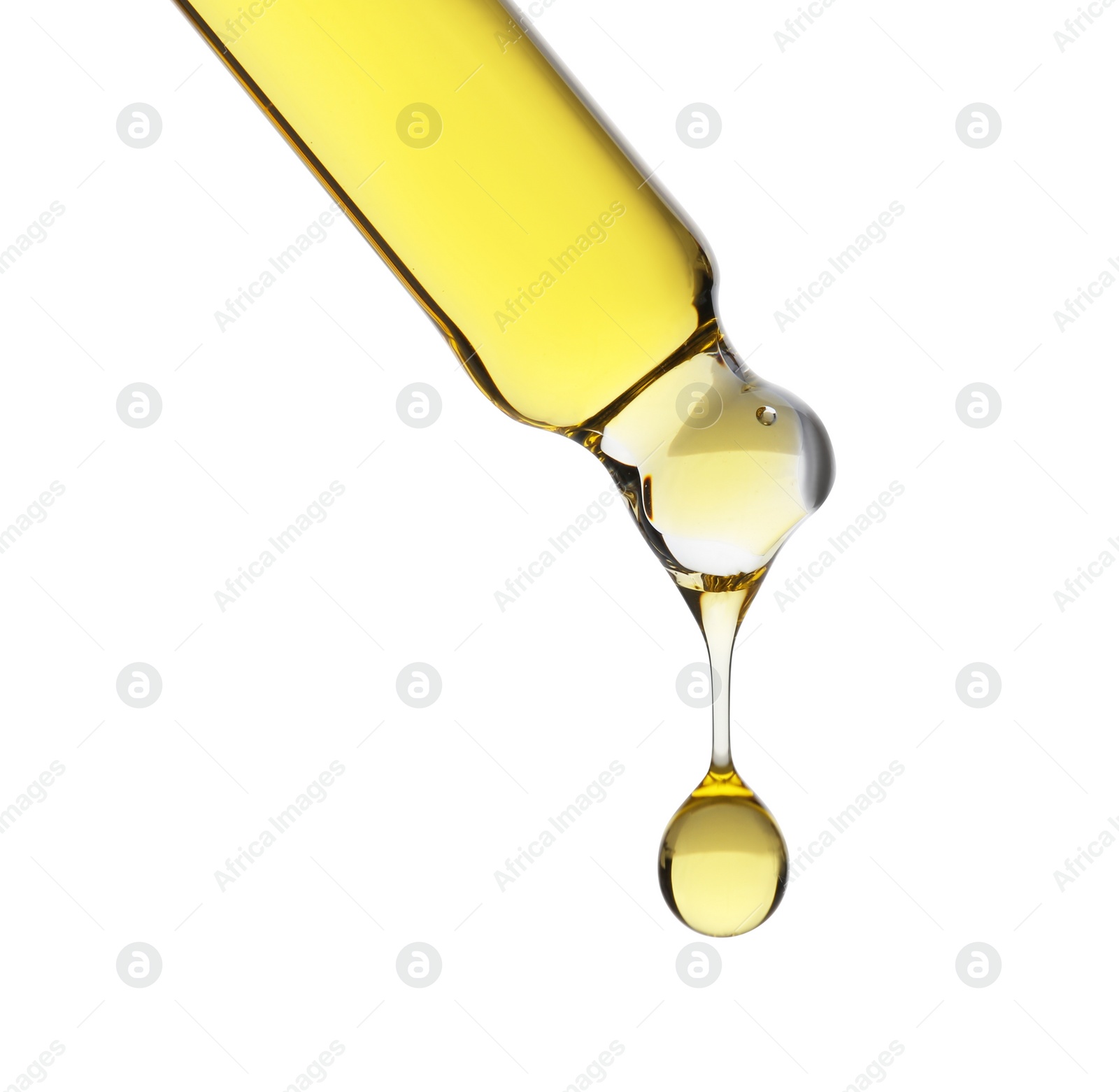 Photo of Dripping tincture from pipette isolated on white