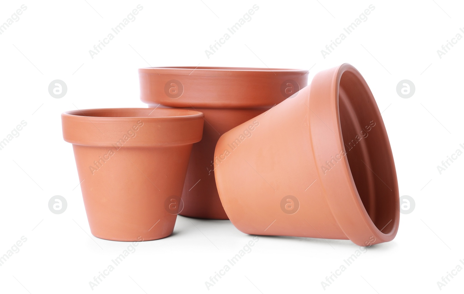 Photo of Stylish terracotta flower pots isolated on white