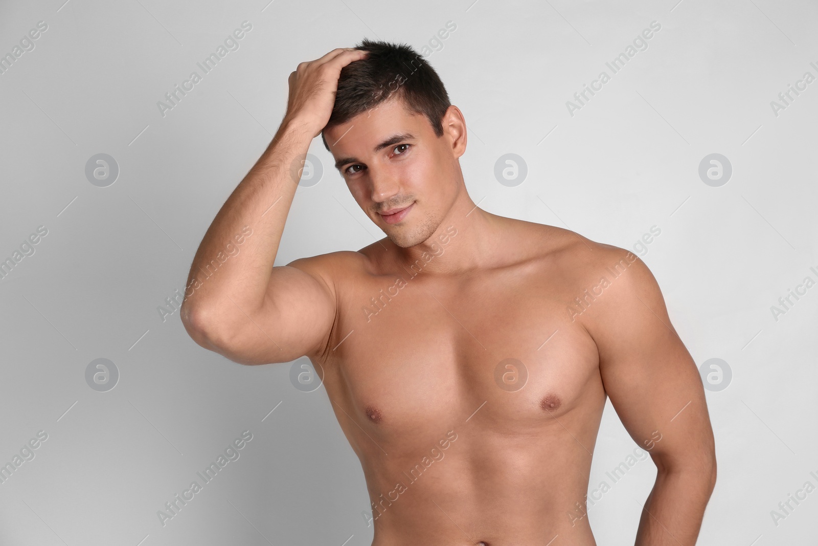 Photo of Man with sexy body on light background