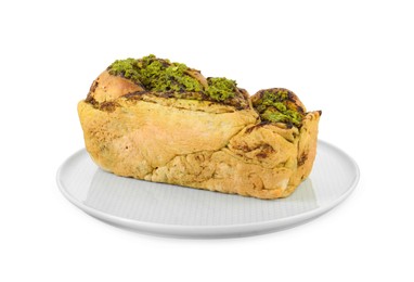 Photo of Plate with freshly baked pesto bread isolated on white