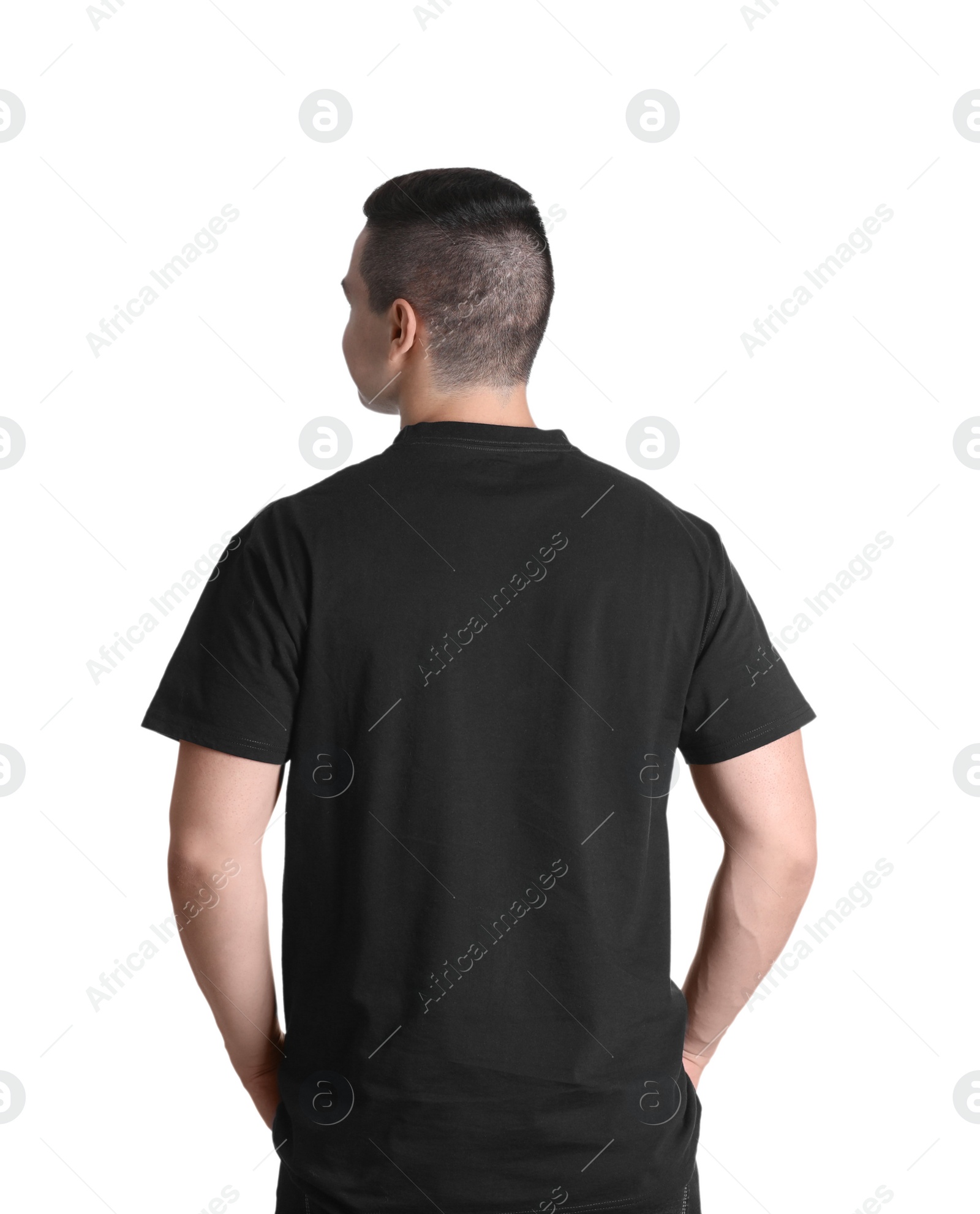 Photo of Young man in black t-shirt on white background. Mockup for design