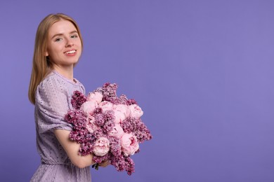 Beautiful woman with bouquet of spring flowers on purple background, space for text