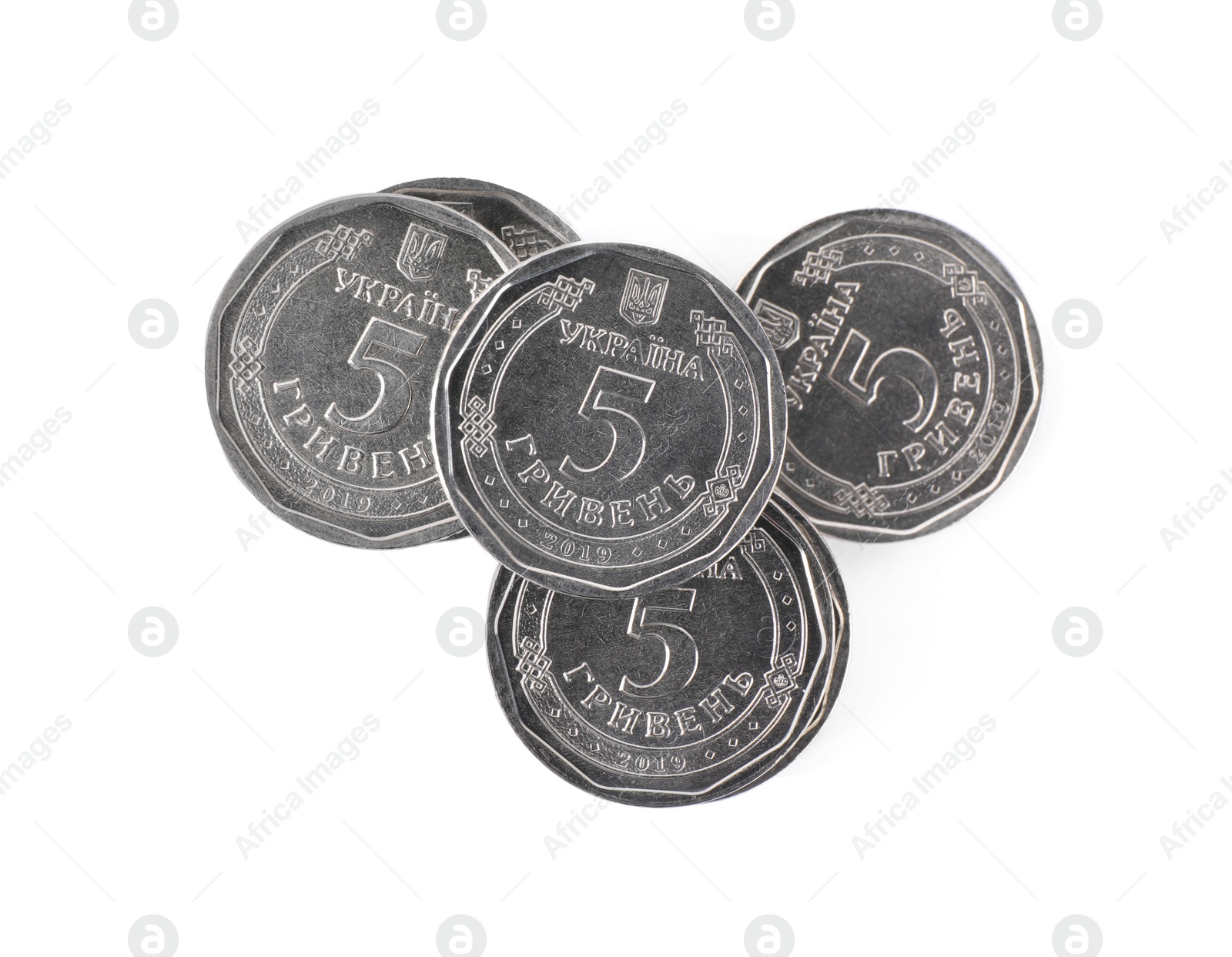 Photo of Ukrainian coins isolated on white, top view. National currency