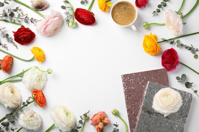 Photo of Notebooks with glitter, spring flowers and cup of coffee on white background, flat lay. Space for text