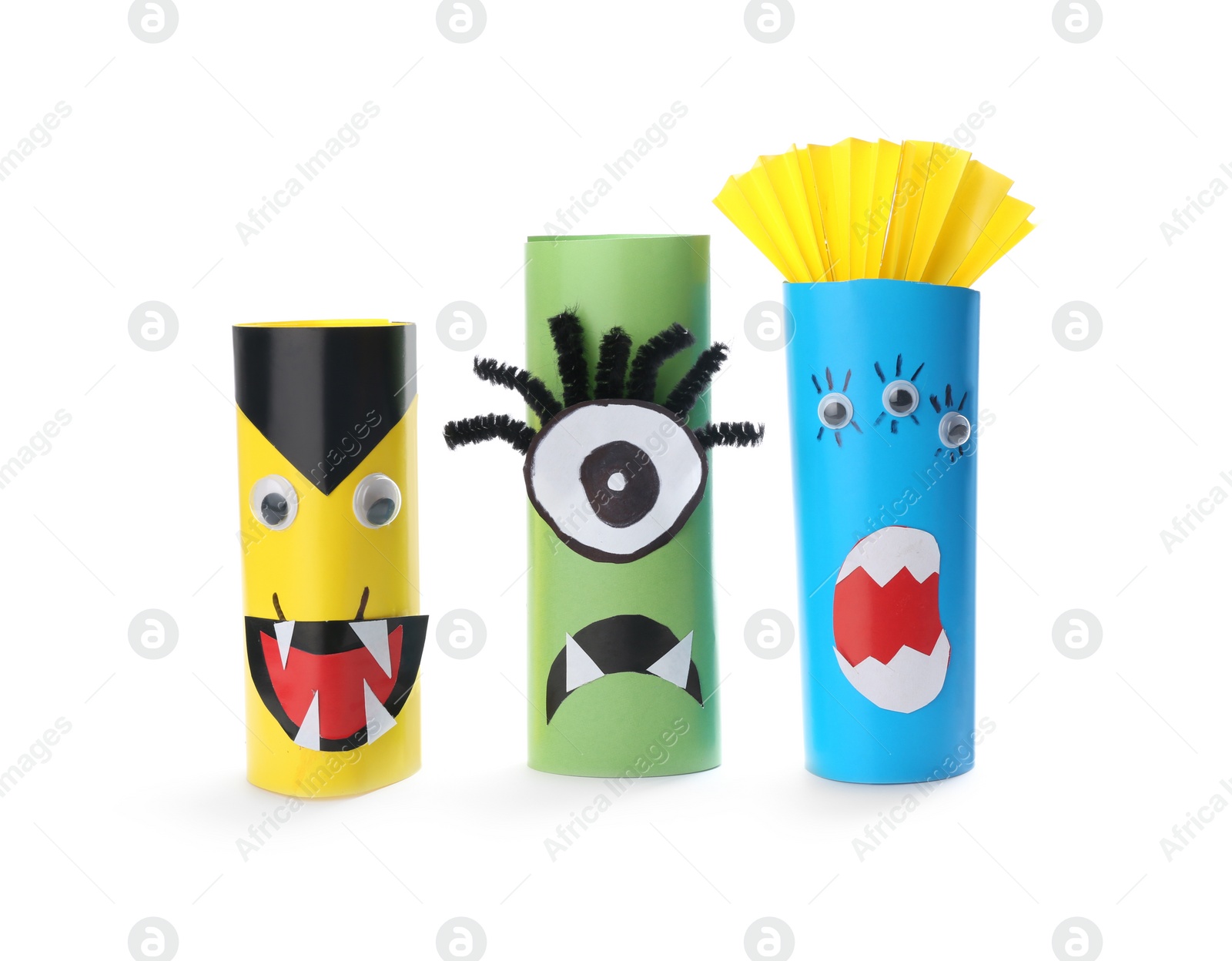 Photo of Funny monsters on white background. Halloween decoration