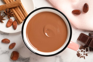 Flat lay composition with yummy hot chocolate on white marble table