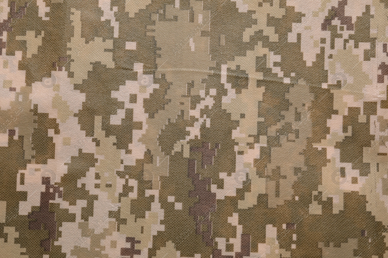 Photo of Texture of camouflage fabric as background, top view