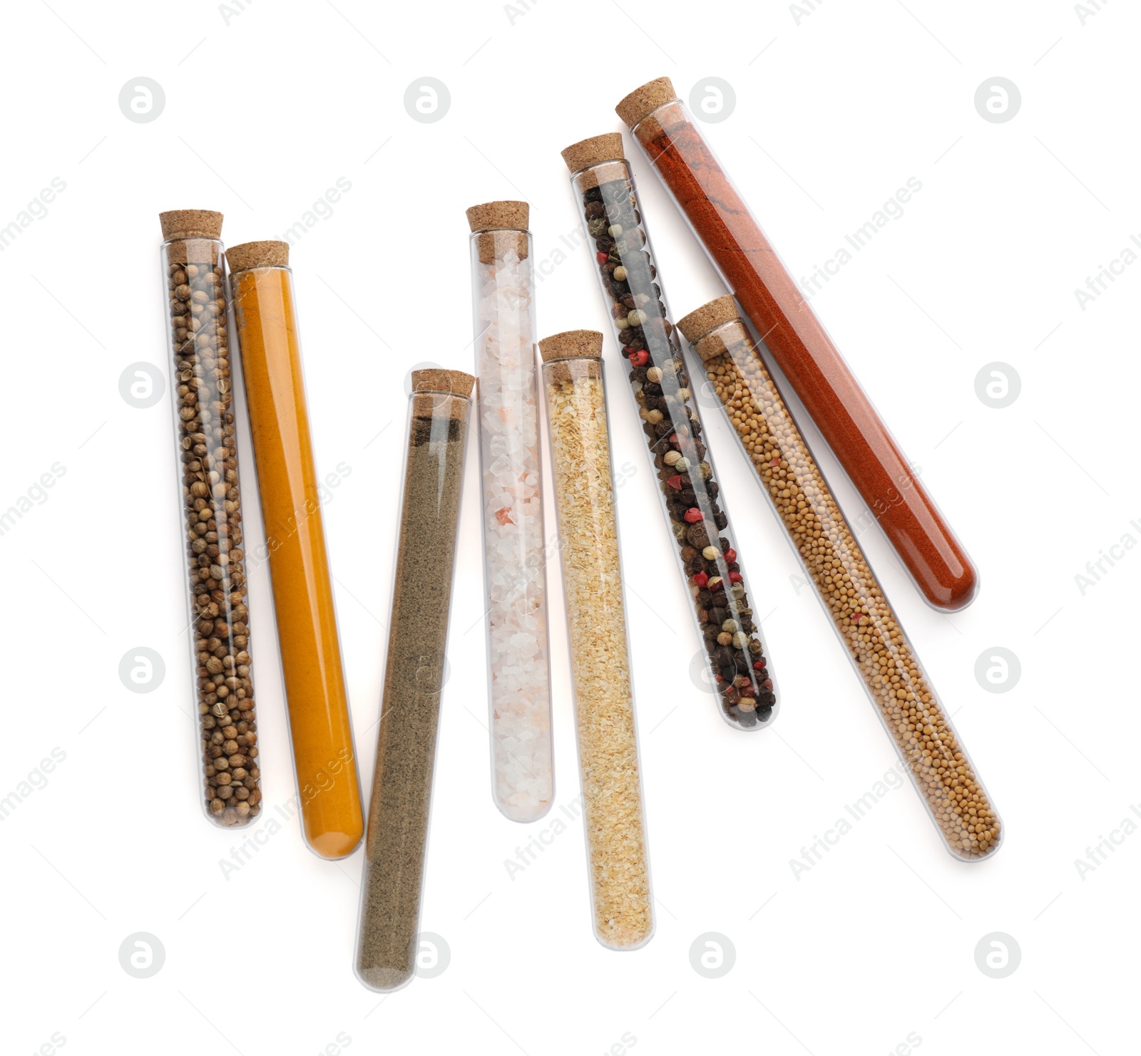 Photo of Glass tubes with different spices on white background, top view