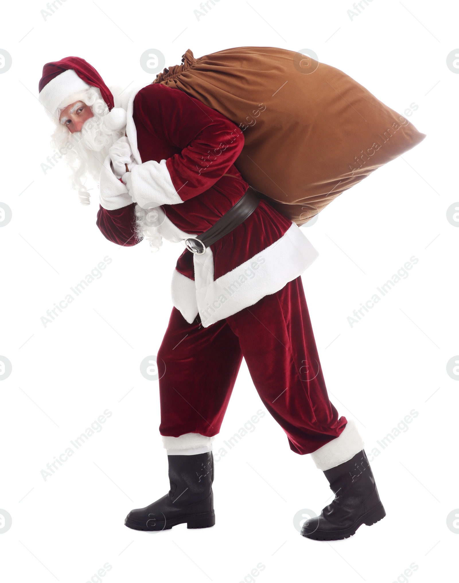 Photo of Santa Claus with sack walking on white background