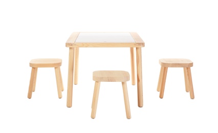 Photo of Wooden table and stools for kids isolated on white