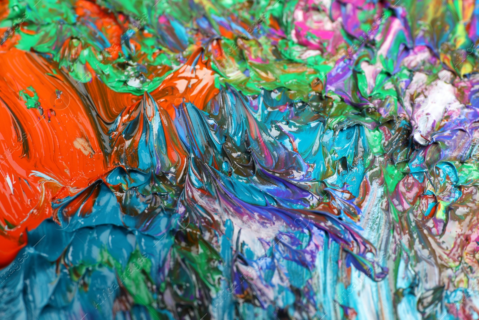 Photo of Abstract colorful acrylic paint as background, closeup view