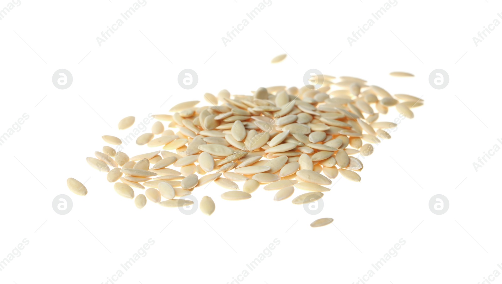 Photo of Pile of raw cucumber seeds on white background. Vegetable planting