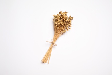 Photo of Bunch of beautiful dried flowers on white background, top view