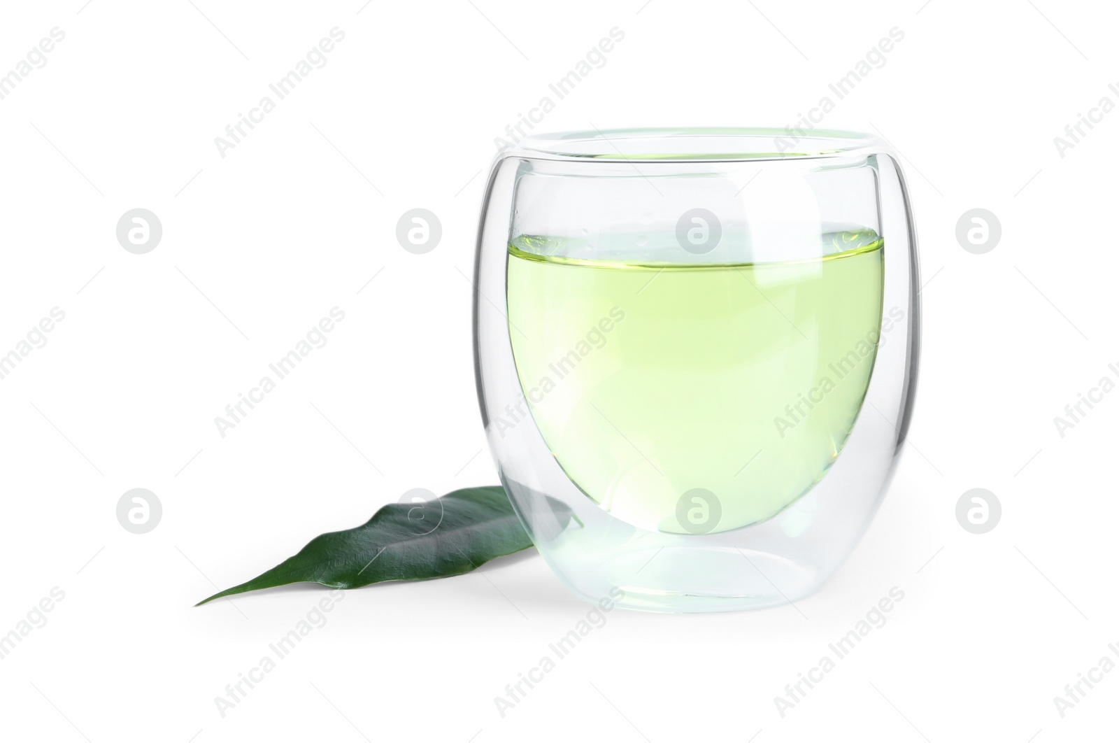 Photo of Aromatic green tea and leaf isolated on white