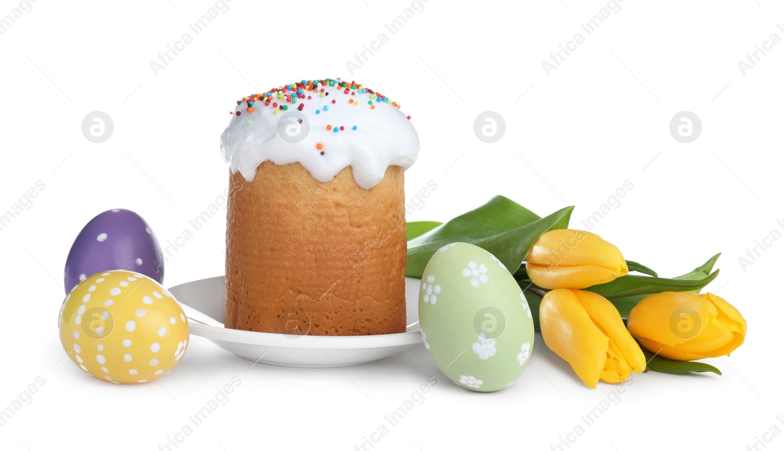 Photo of Traditional Easter cake, tulips and colorful eggs on white background