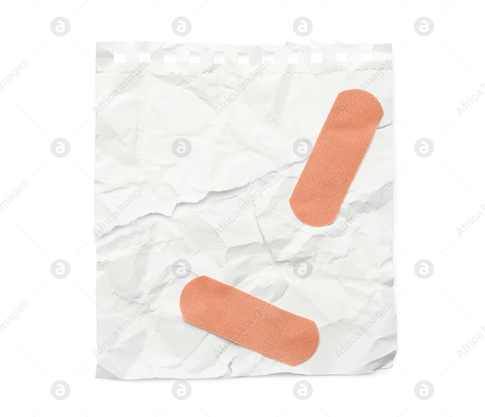 Photo of Crumpled paper with sticking plasters isolated on white, top view