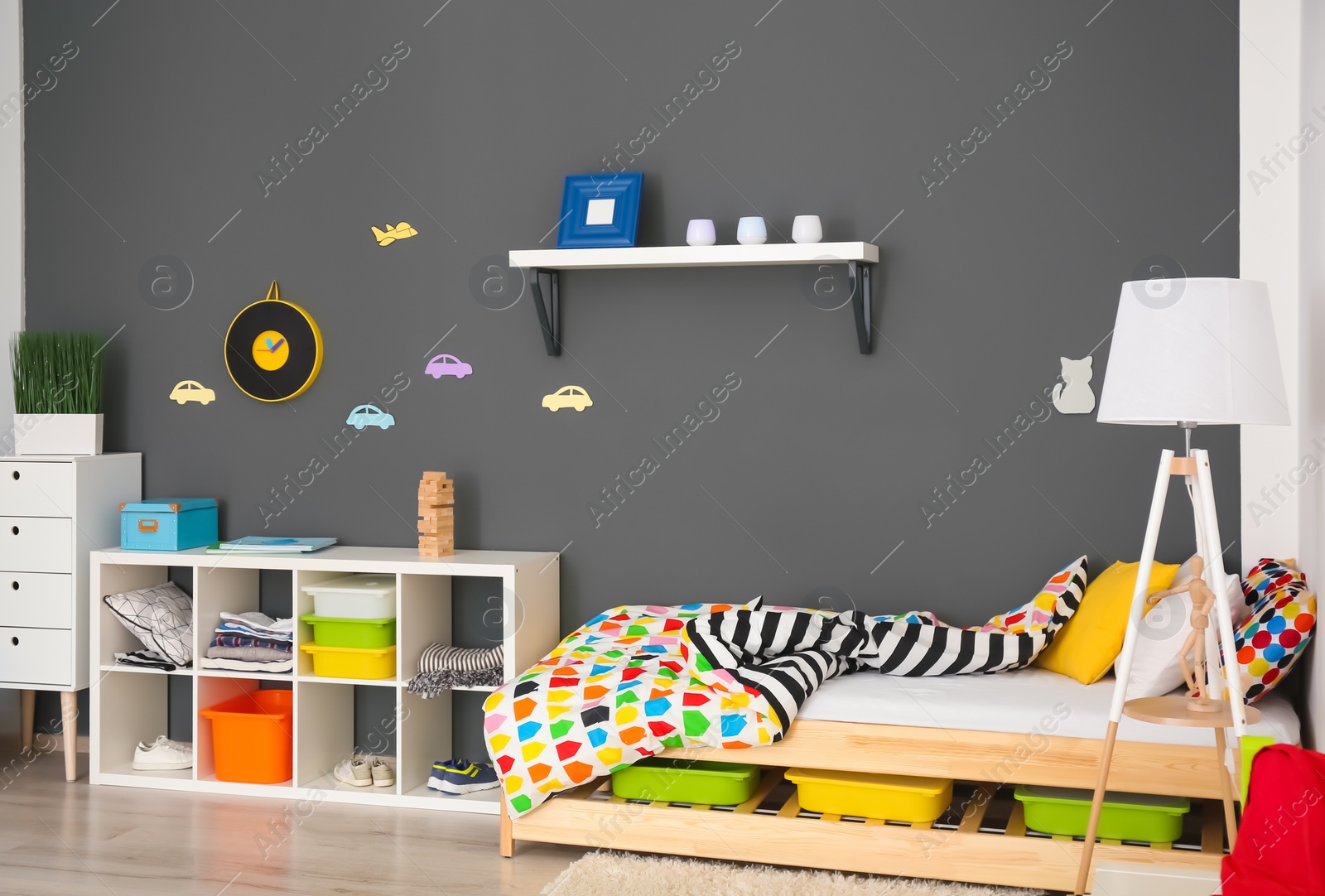 Photo of Modern room interior with comfortable bed for child