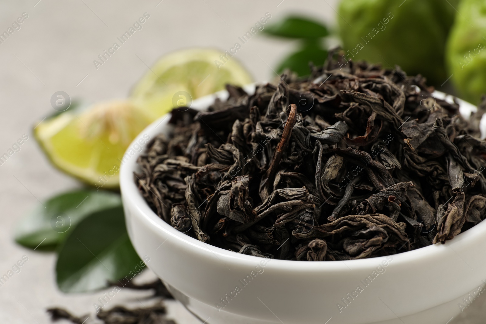 Photo of Dry bergamot tea leaves in bowl, closeup