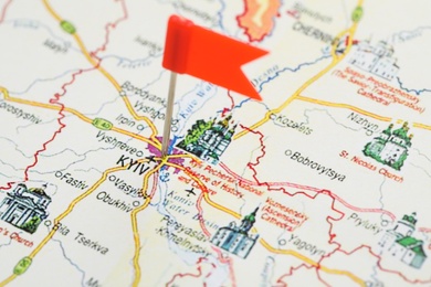 MYKOLAIV, UKRAINE - NOVEMBER 09, 2020: Kyiv city marked with push pin on map of Ukraine, closeup