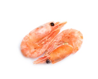 Photo of Raw shrimps covered with ice on white background, top view