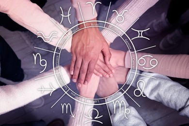 Relationships and horoscope. Zodiac wheel and photo of people joining hands together, closeup