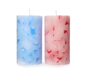 Two color wax candles on white background