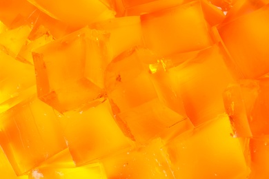 Tasty natural jelly cubes as background, closeup