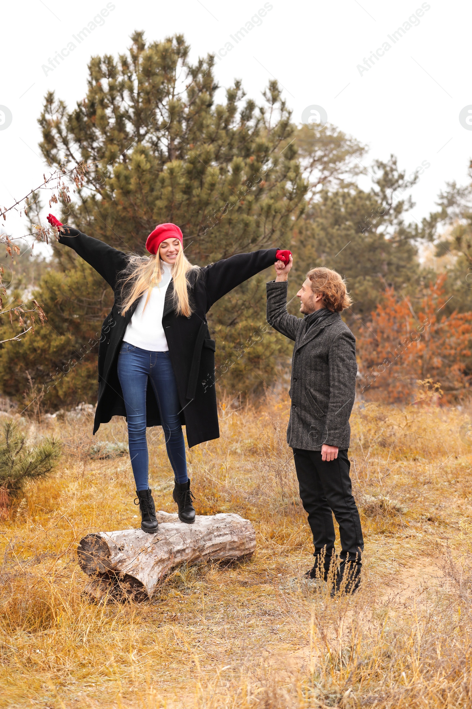 Photo of Romantic couple having fun in park on autumn day