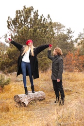 Romantic couple having fun in park on autumn day