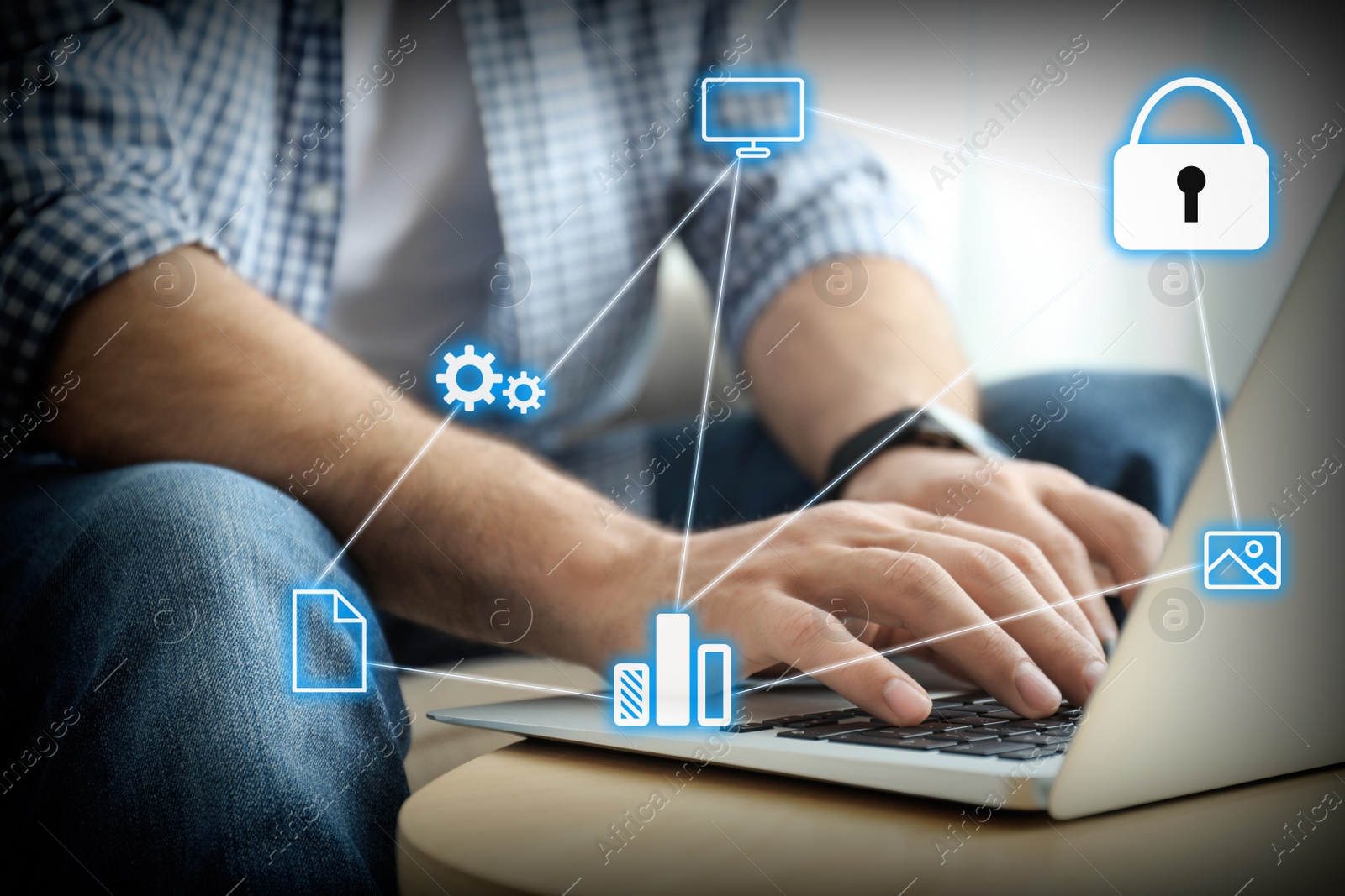 Image of Information security. Young man using laptop at table indoors, closeup