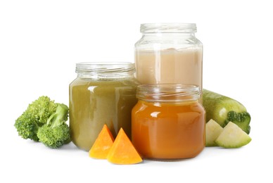 Photo of Jars with healthy baby food, broccoli, pumpkin and zucchini isolated on white