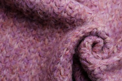 Photo of Closeup of violet knitted fabric as background, above view