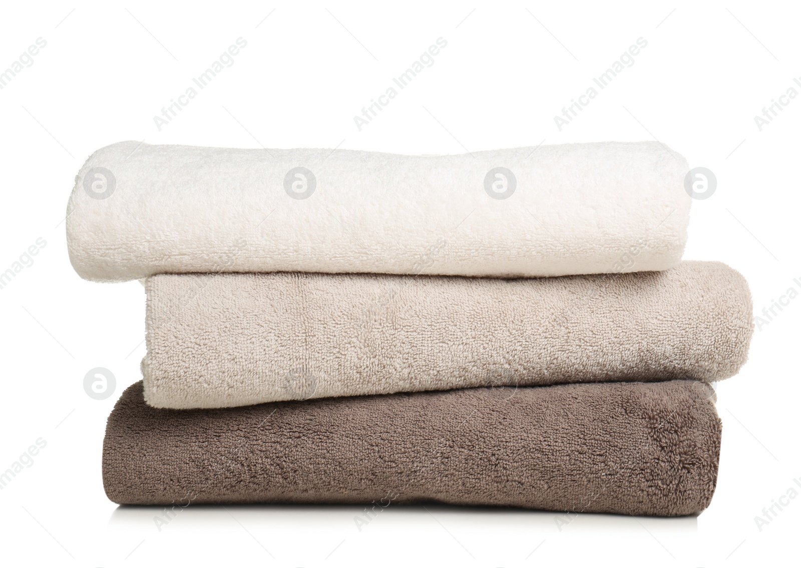 Photo of Folded soft terry towels on white background