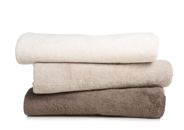 Folded soft terry towels on white background