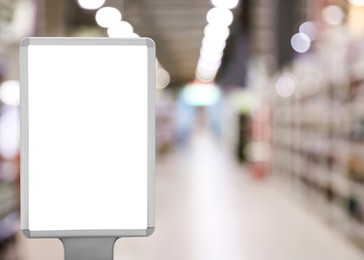 Image of Blank advertising board in supermarket. Mockup for design