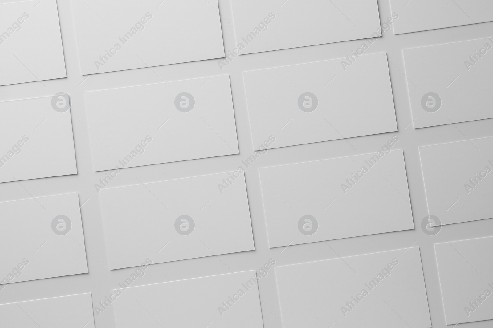 Photo of Blank business cards on white background, flat lay. Mockup for design