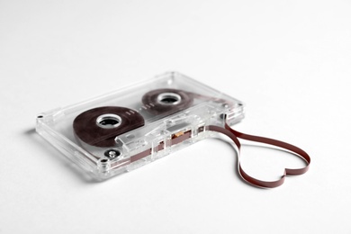Photo of Music cassette and heart made with tape on white background. Listening love song