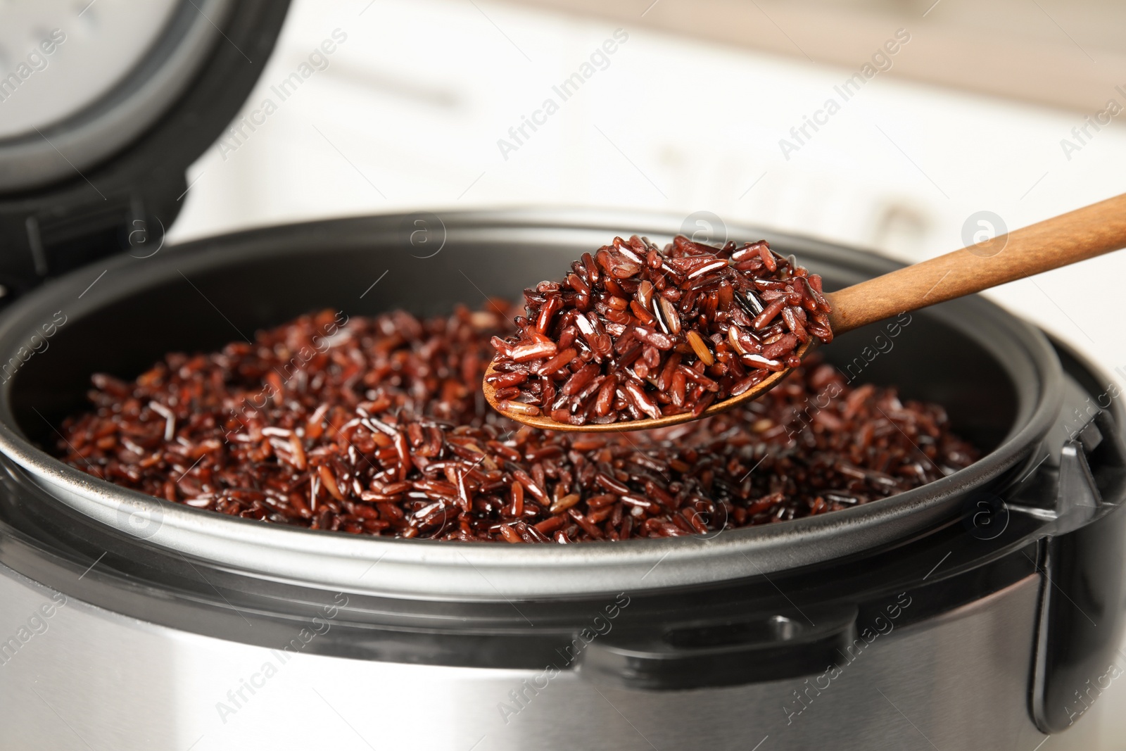 Photo of Delicious brown rice boiled in modern multi cooker