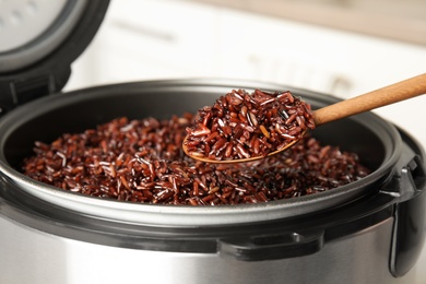 Photo of Delicious brown rice boiled in modern multi cooker