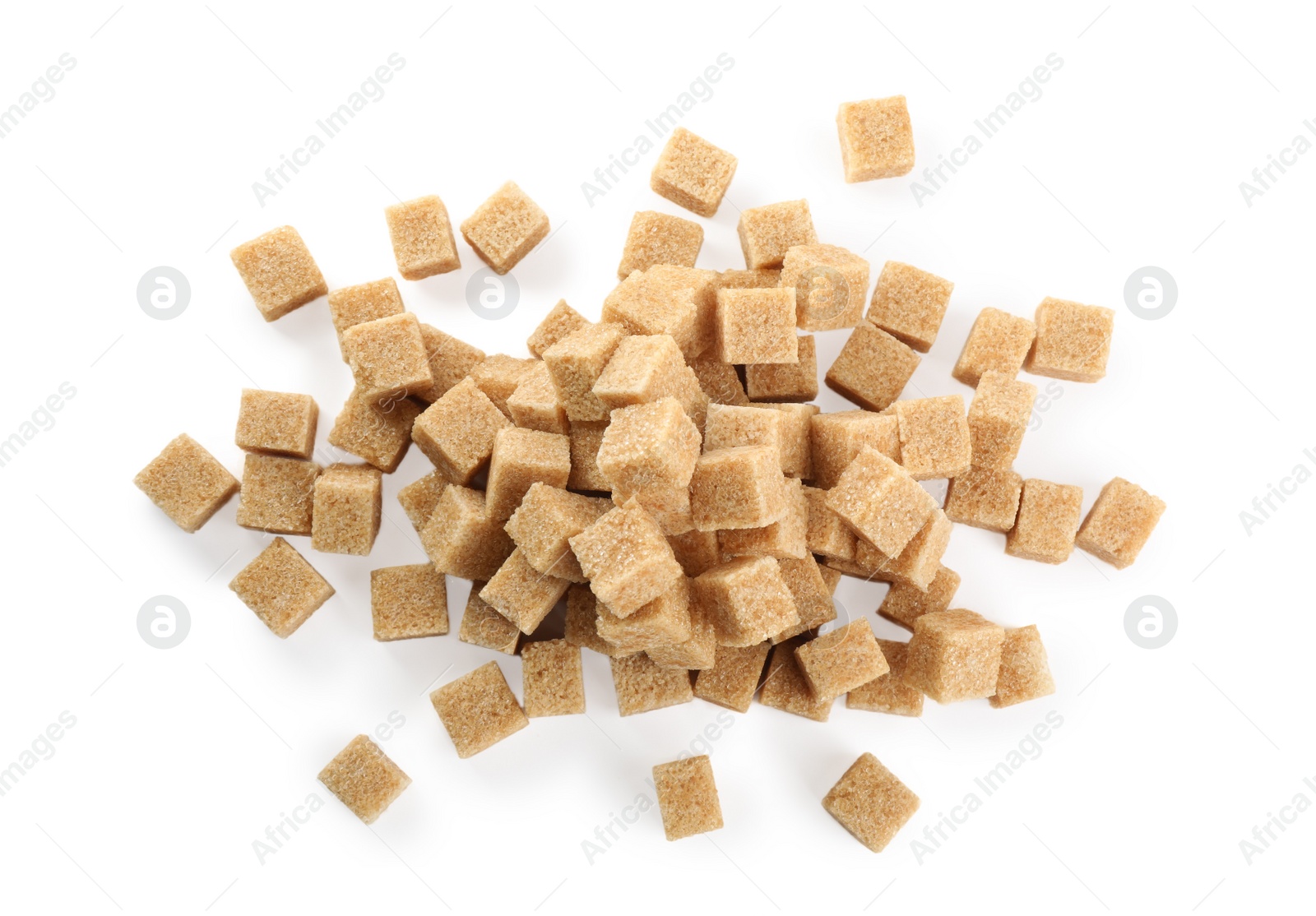 Photo of Pile of brown sugar cubes on white background, top view