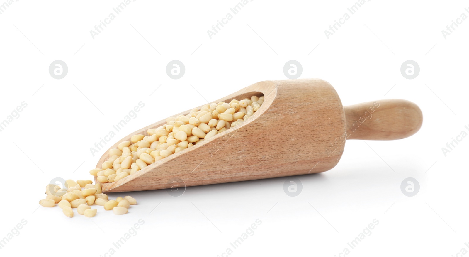 Photo of Scoop with pine nuts on white background