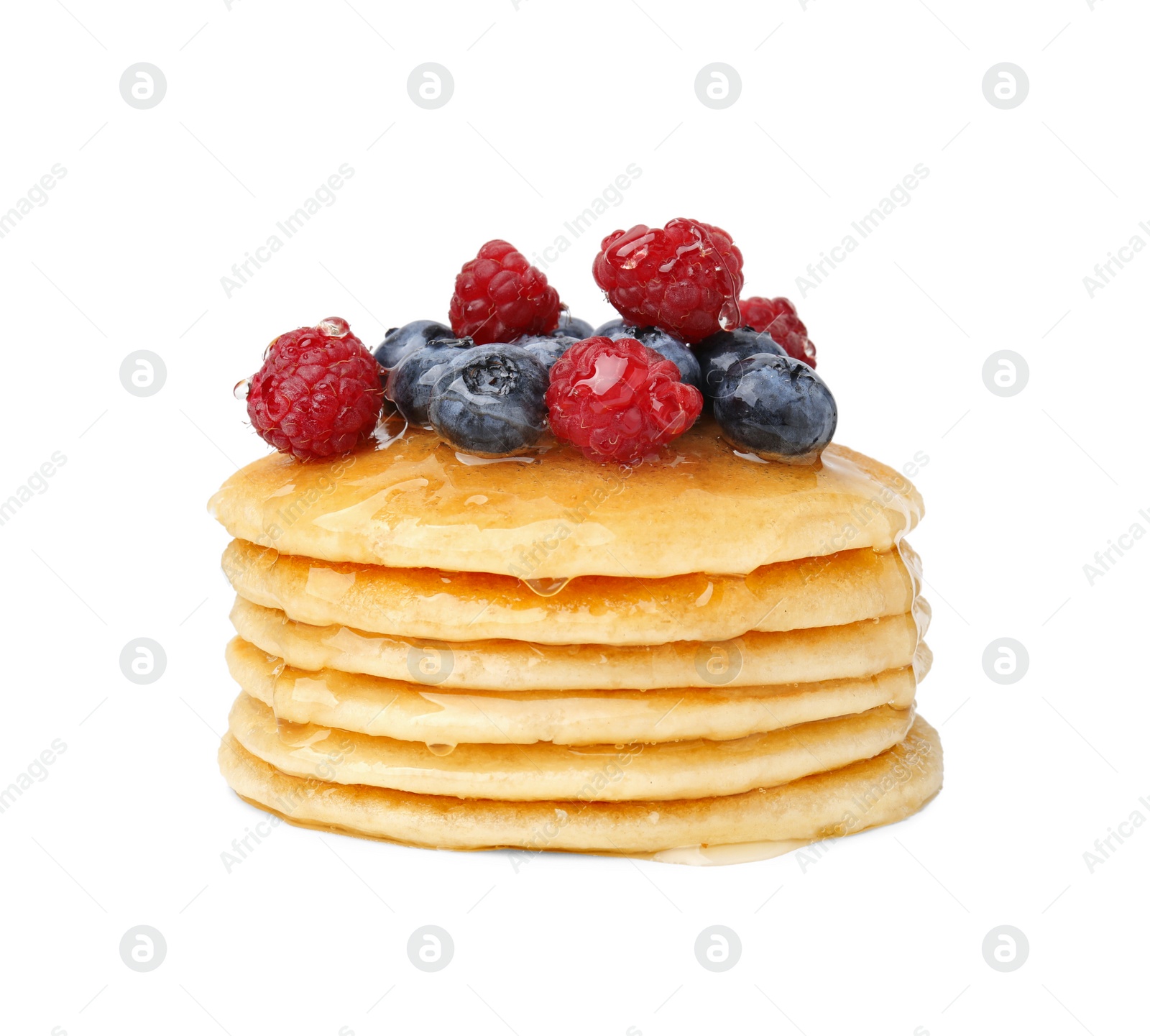 Photo of Stack of tasty pancakes with berries and honey isolated on white