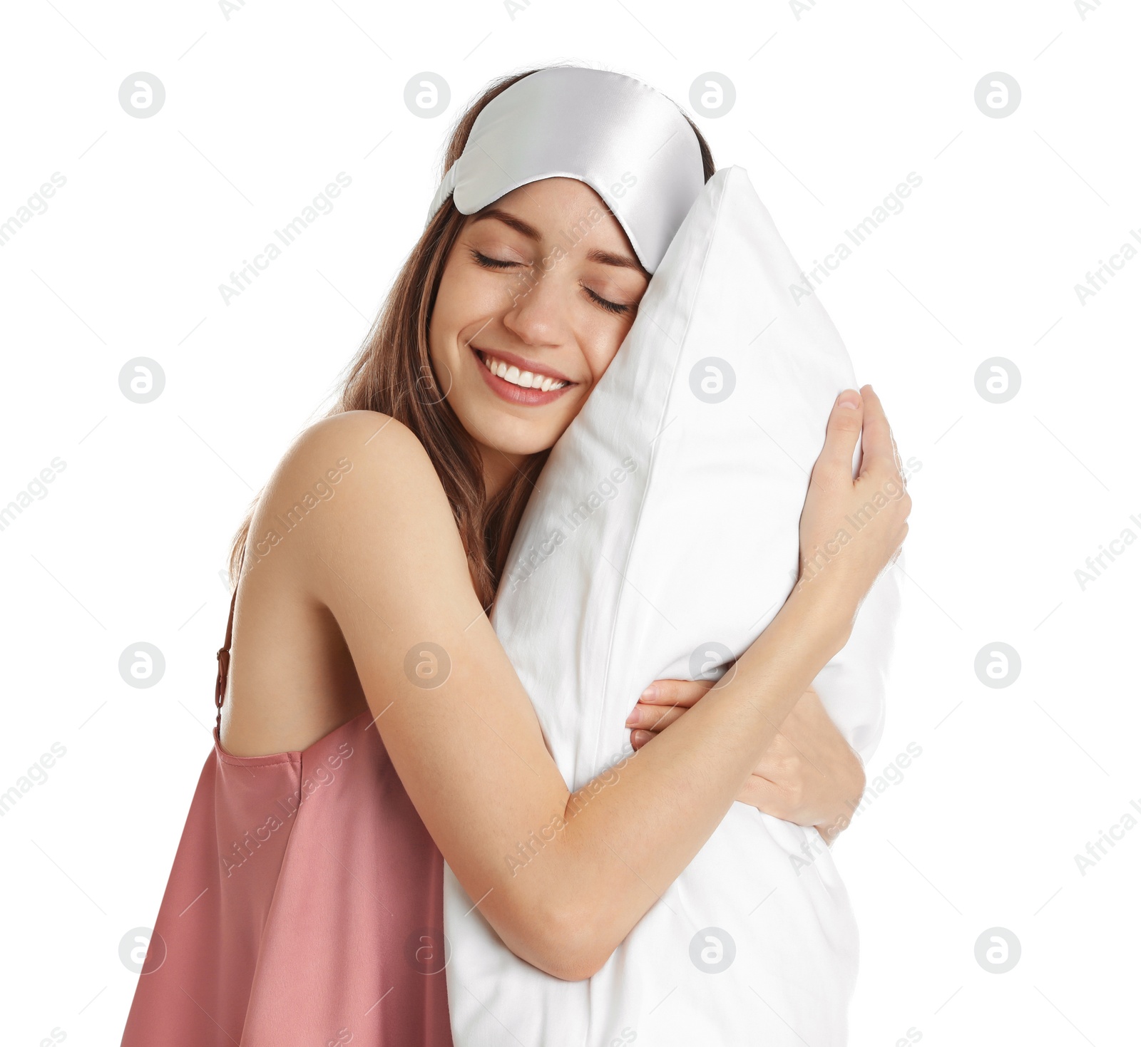 Photo of Beautiful woman with pillow and sleep mask on white background. Bedtime