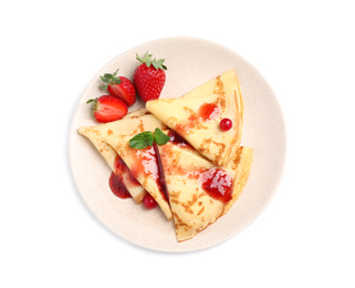 Photo of Delicious thin pancakes with strawberries and jam isolated on white, top view