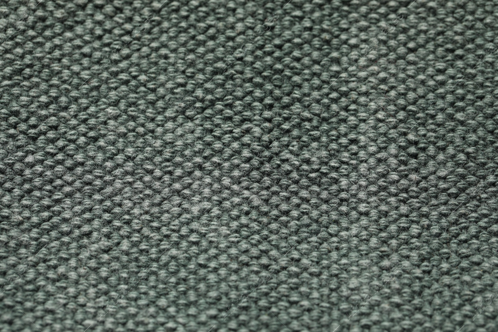 Photo of Texture of soft grey knitted fabric as background, top view